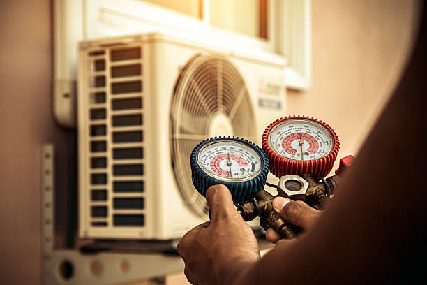 Professional Air Conditioning Service technician working in Little Ferry, NJ